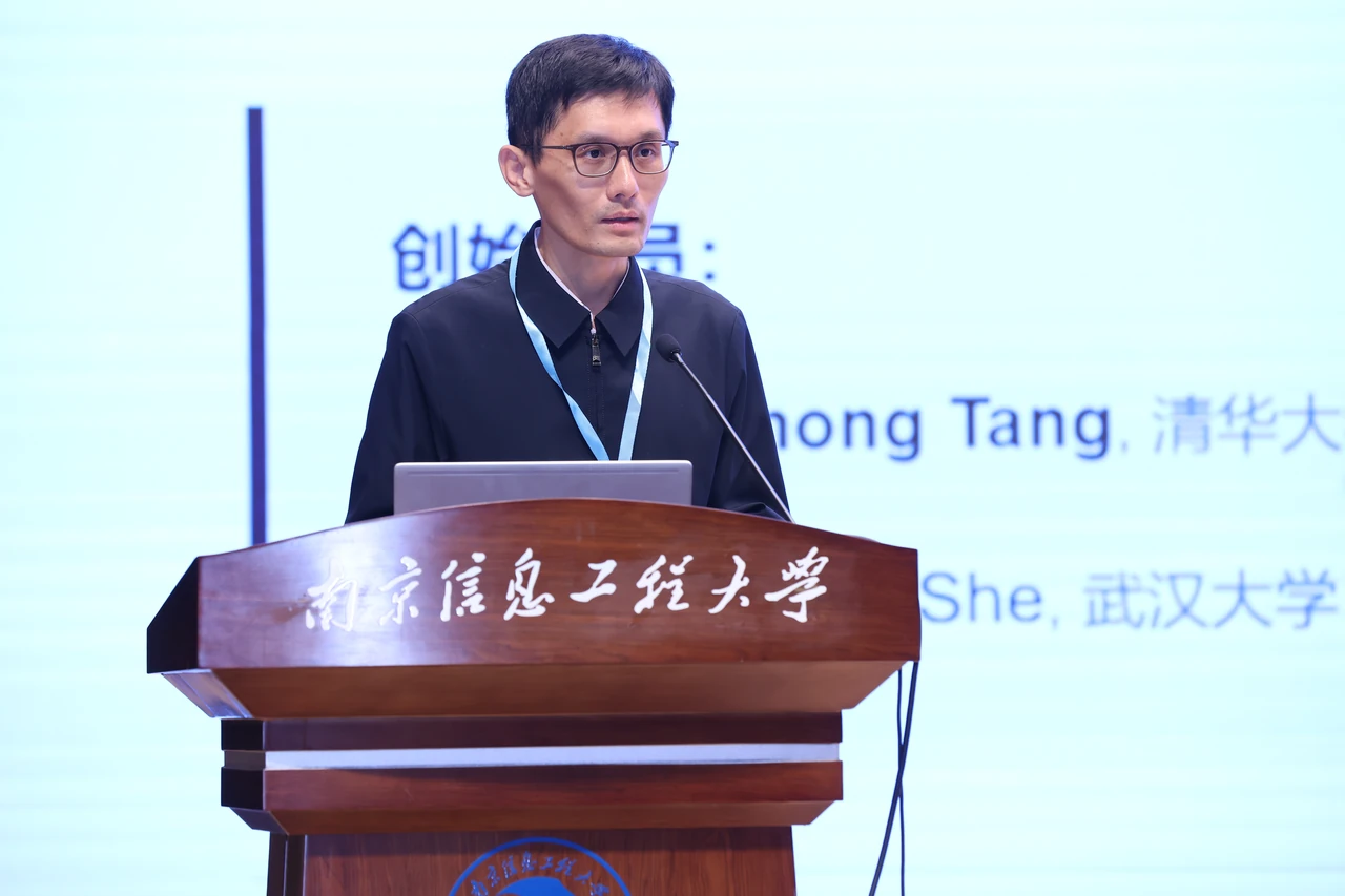 Huimin Lei gives a presentation.