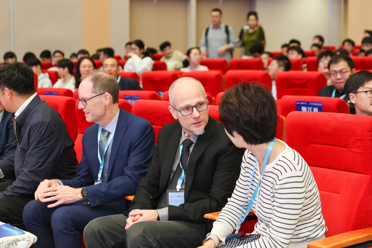 Participants discuss research during the meeting.