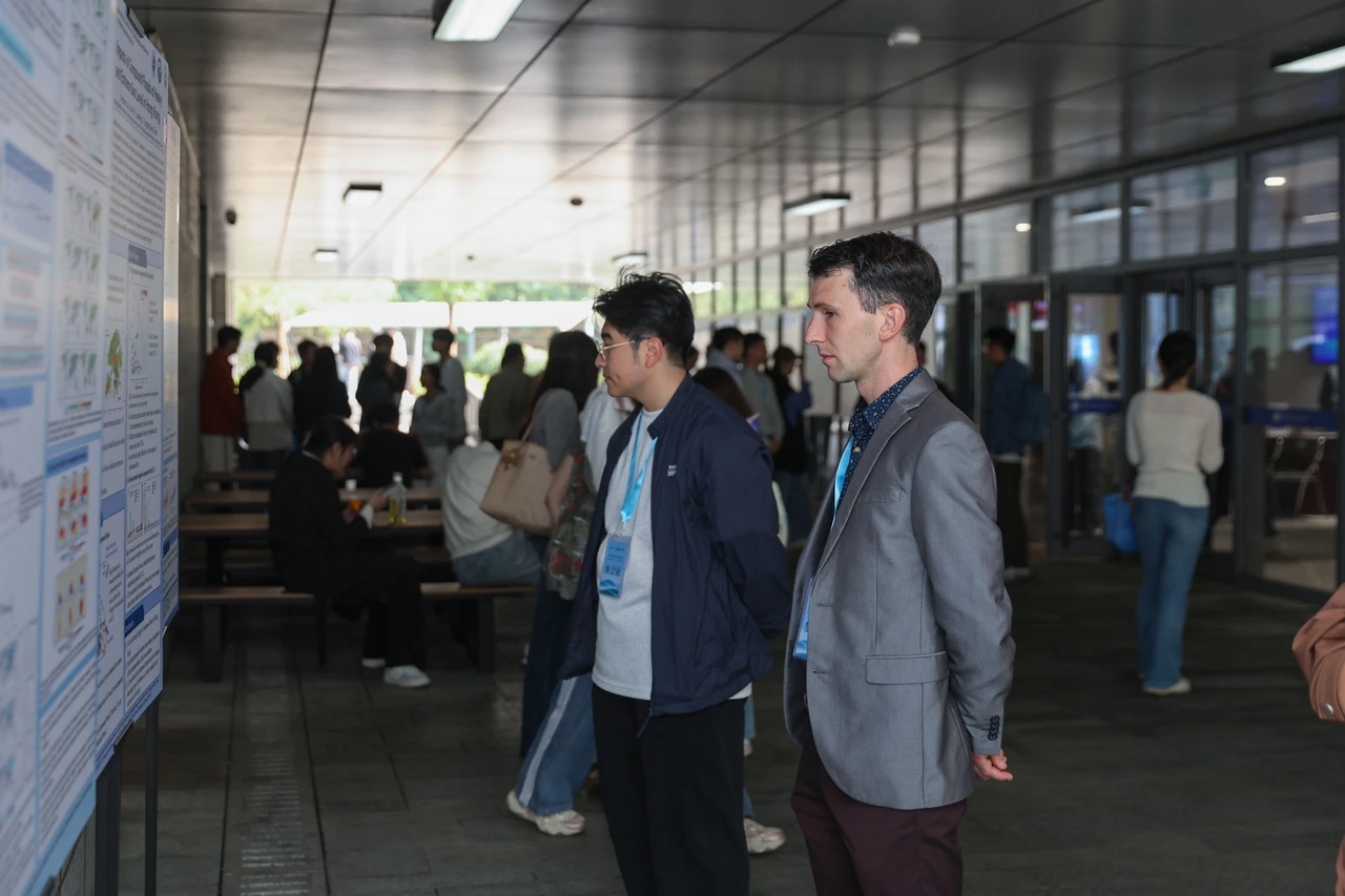 Participants exchange ideas at the poster displays.