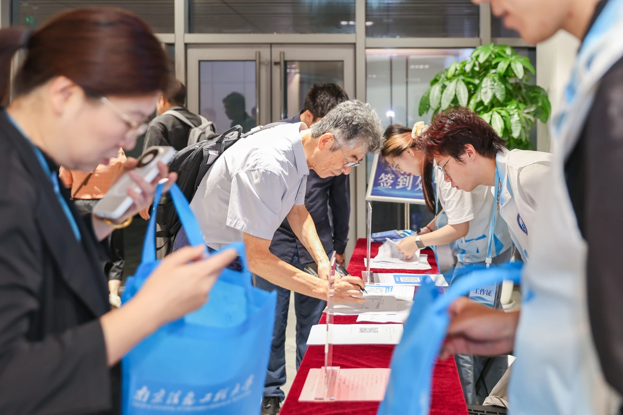 Volunteers welcome participants at registration.